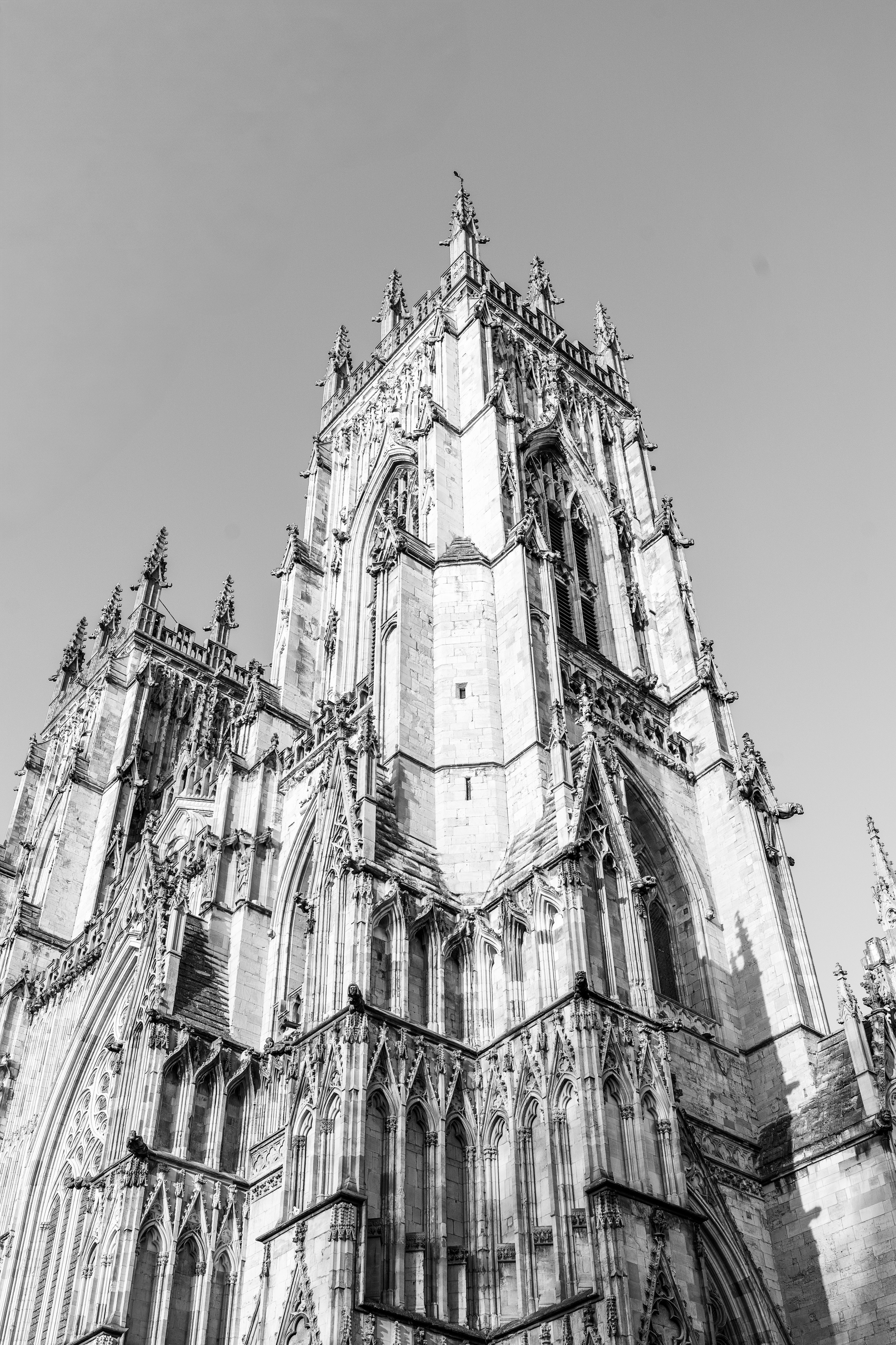 Grayscale Low Angle View of Cathedral · Free Stock Photo