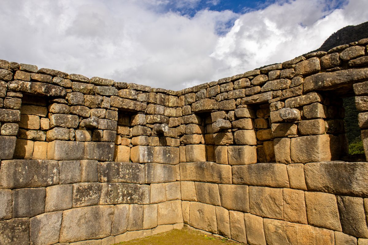 Ancient Inca Wall Photograph of a Stone Wall with a Window · Free Stock Photo