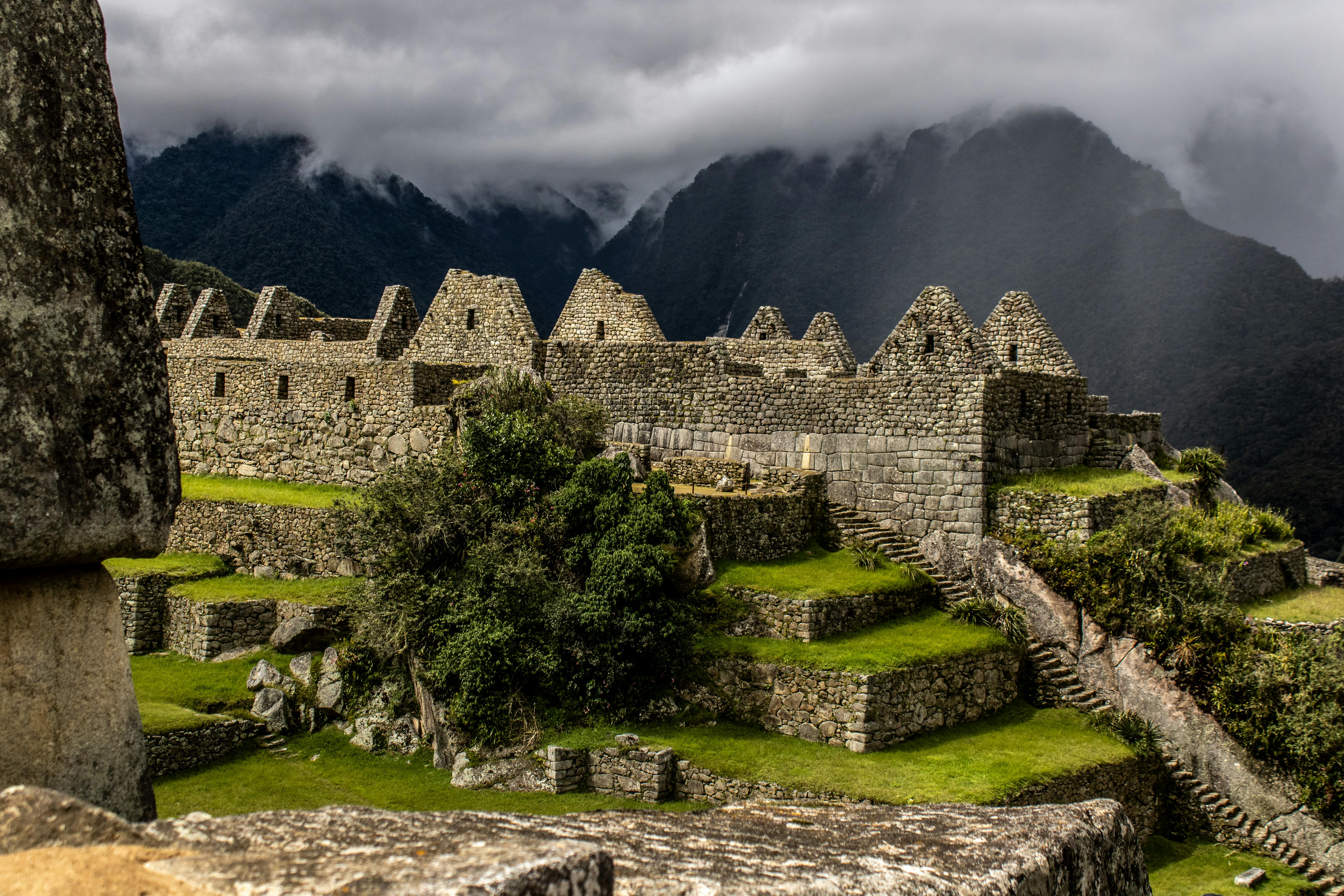 Machu Picchu ruins with misty mountains in Peru