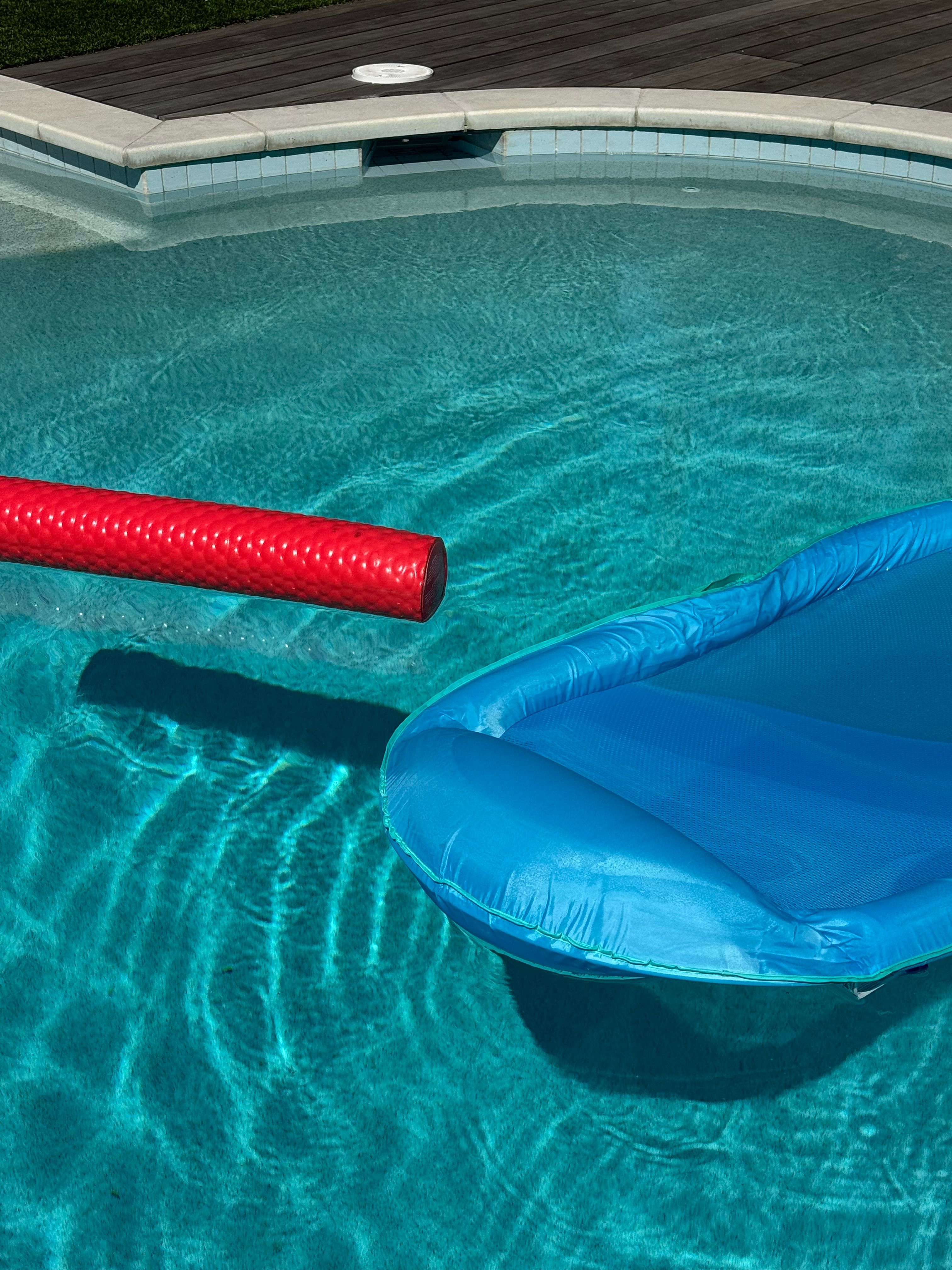 Summer Pool Scene with Inflatable Floats · Free Stock Photo