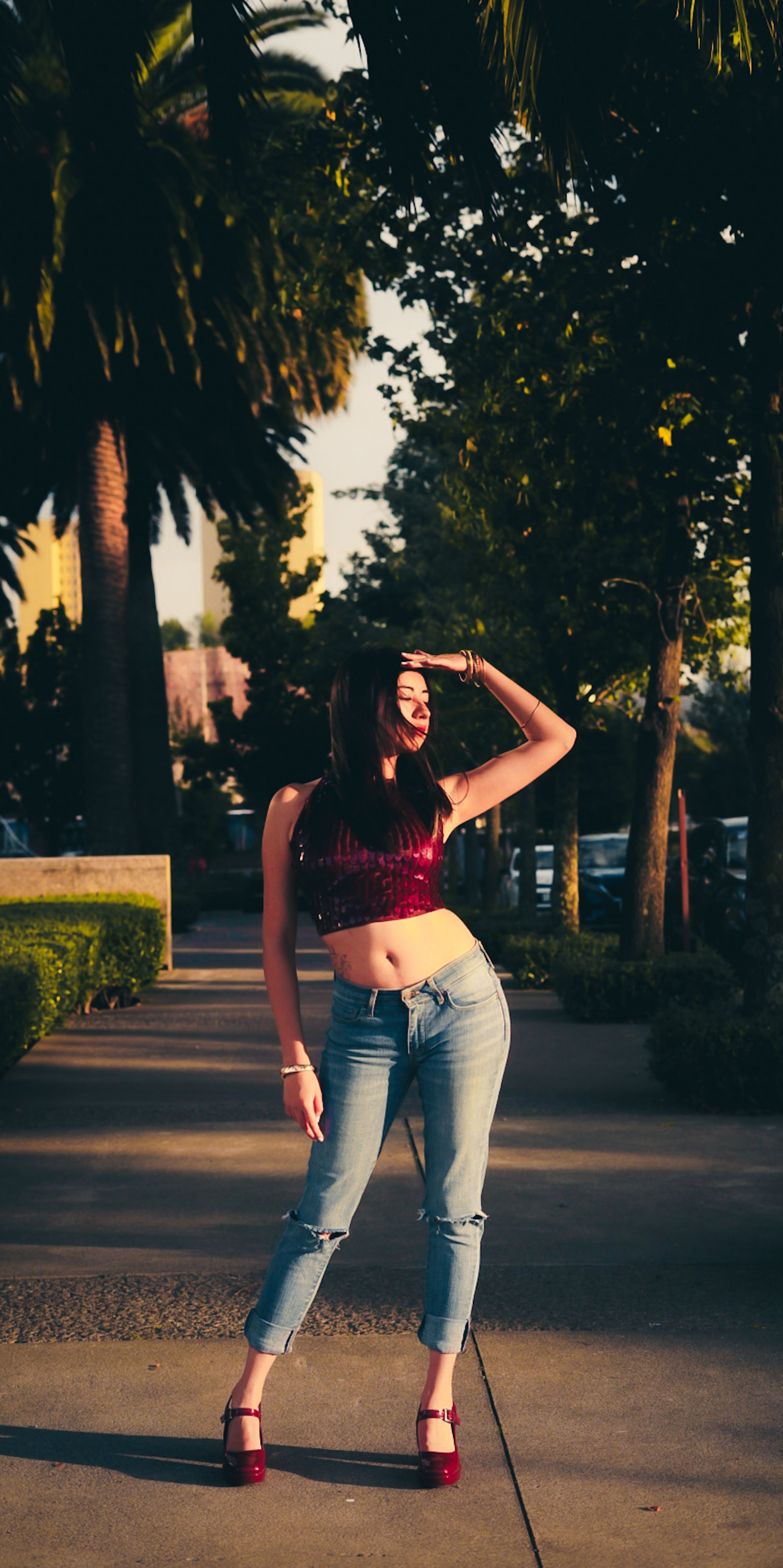 Stylish Woman Posing in Sunny Urban Park · Free Stock Photo
