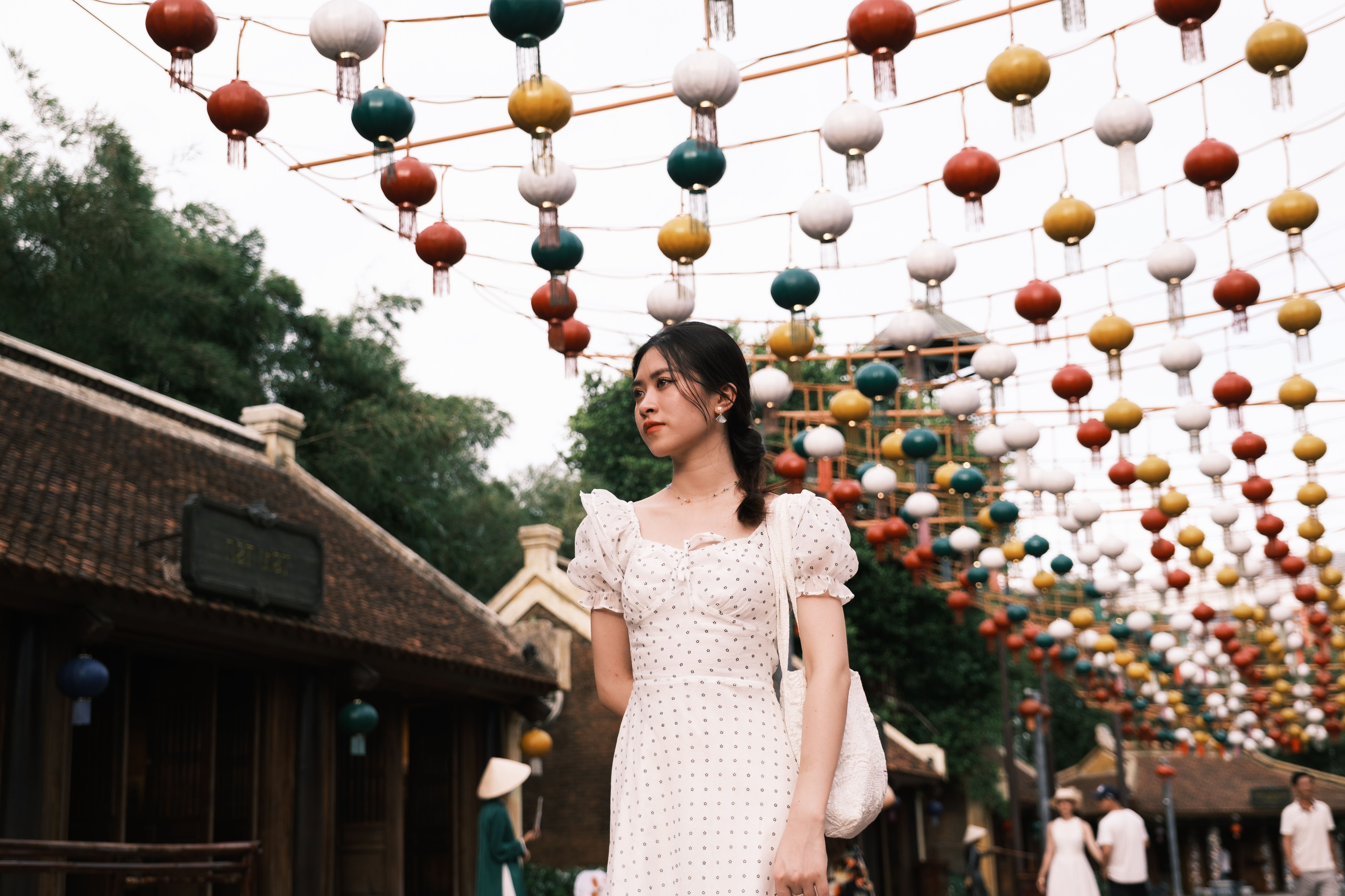Woman in White Dress Under Colorful Lanterns · Free Stock Photo