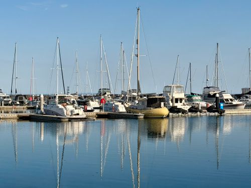 Free Peaceful marina view with boats and clear reflections at Werribee South, Victoria. Stock Photo