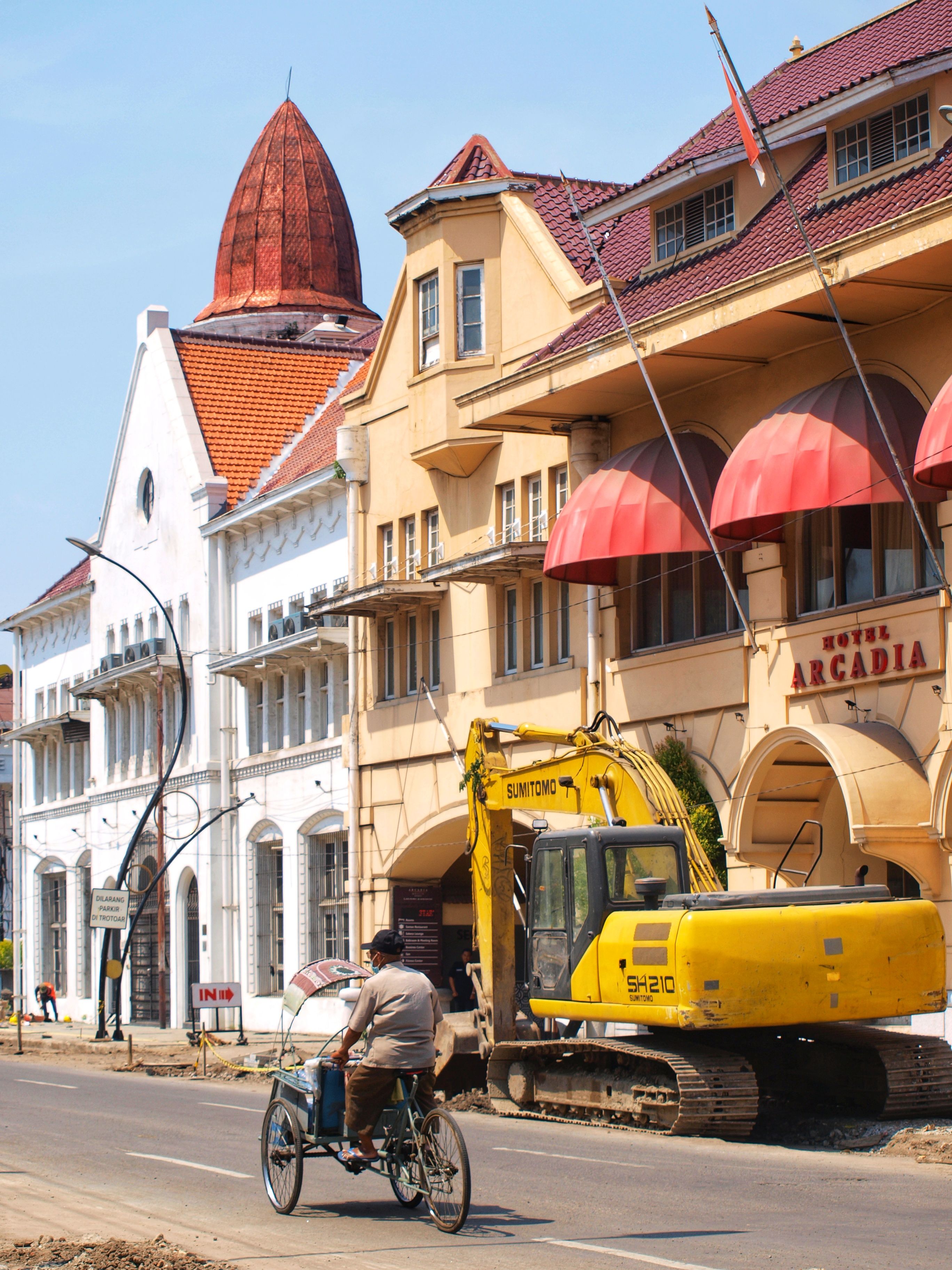 A historic street with unique architecture and ongoing construction captured during the day.