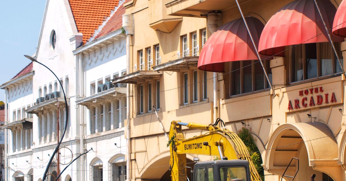 A historic street with unique architecture and ongoing construction captured during the day.