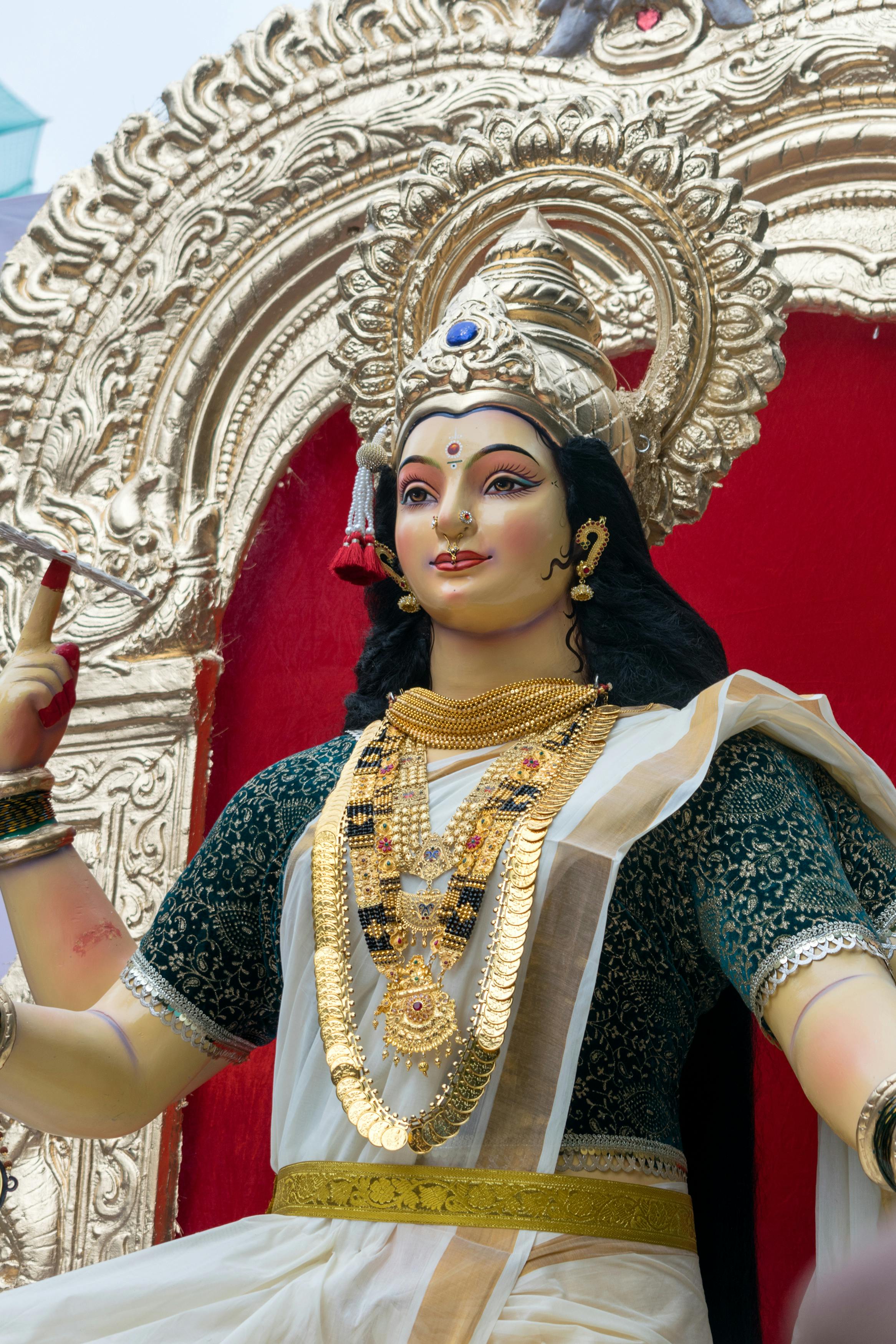 Intricately designed statue of a Hindu goddess adorned with jewelry and traditional attire in Mumbai.