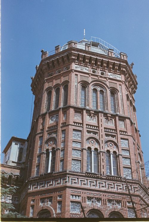 Free Historic Greek Orthodox College tower in Istanbul showcases Byzantine architecture against a clear sky. Stock Photo