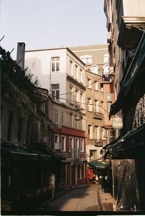 Free A picturesque alley in Istanbul showcasing classic architecture full of charm and history, bathed in warm sunlight. Stock Photo