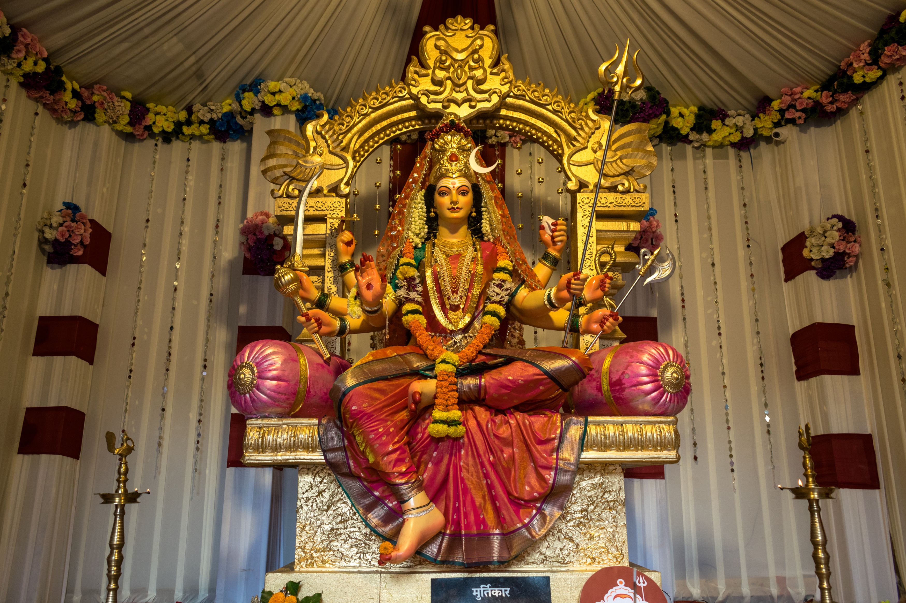 Intricately decorated Durga idol displayed during Navratri festival in Mumbai temple, India.