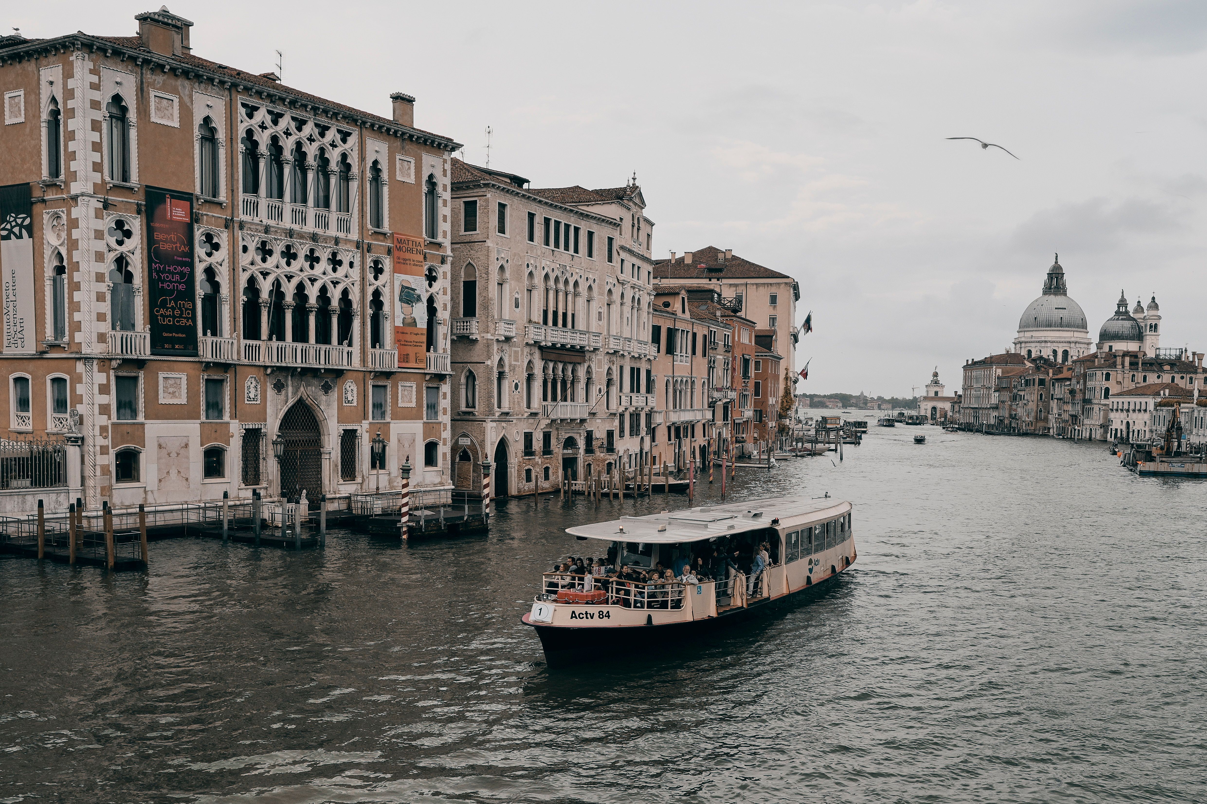 Vaporetto water bus navigating a canal in Venice, Italy