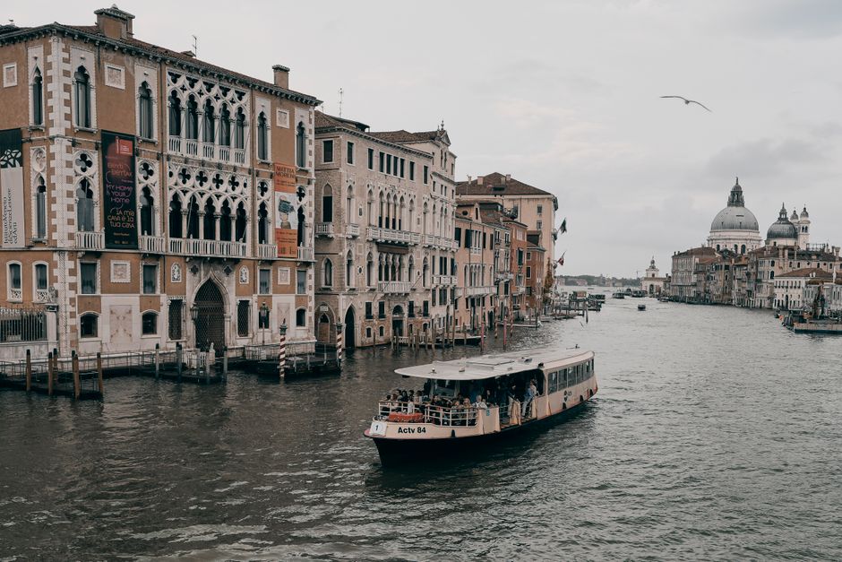 Vaporetto water bus navigating a canal in Venice, Italy