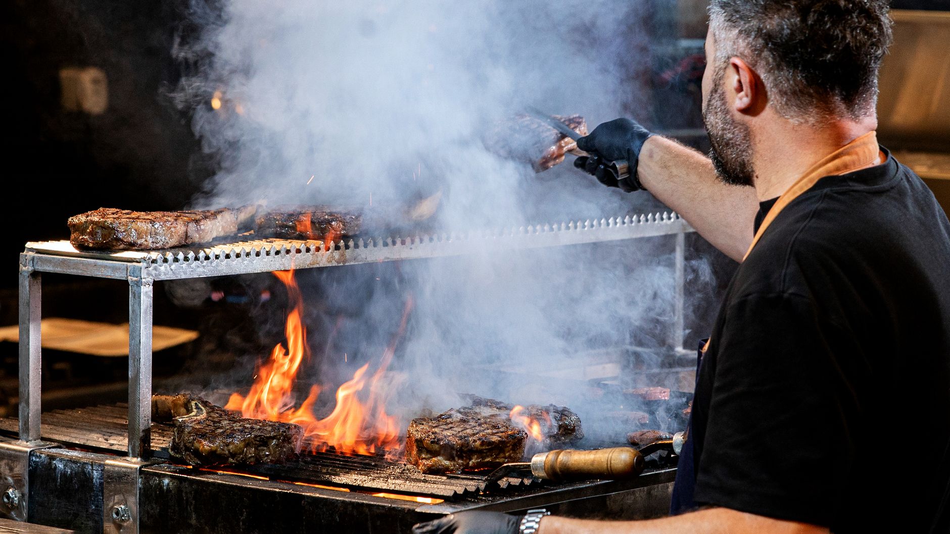 Grilled steak sizzling on a barbecue grill