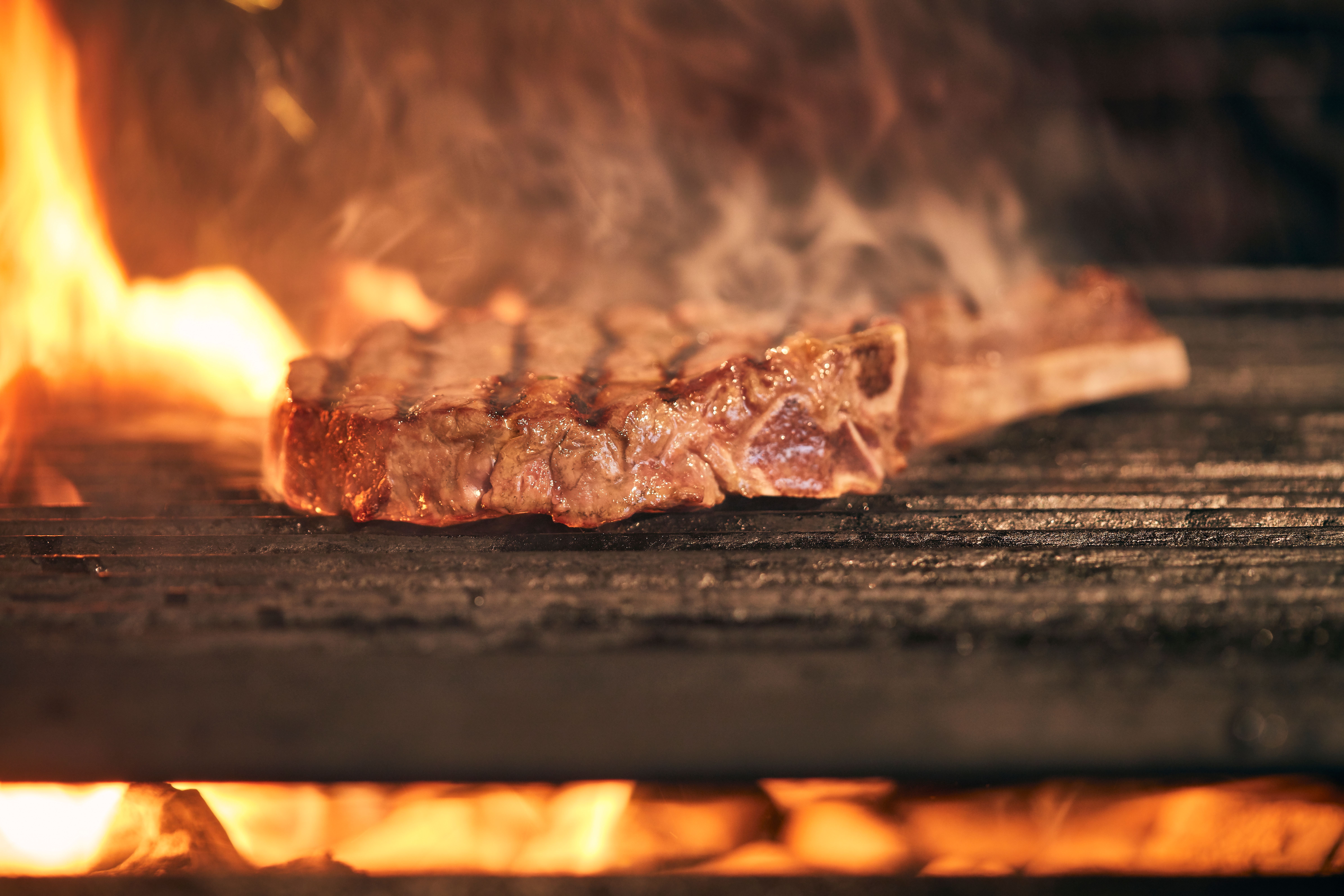 Juicy Grilled Steak Over Open Flame · Free Stock Photo