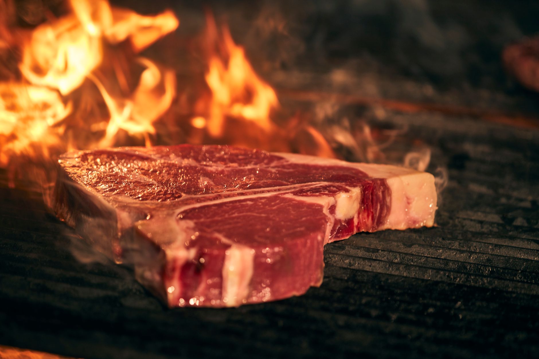 Steak plated with sides and garnish at a casual steakhouse