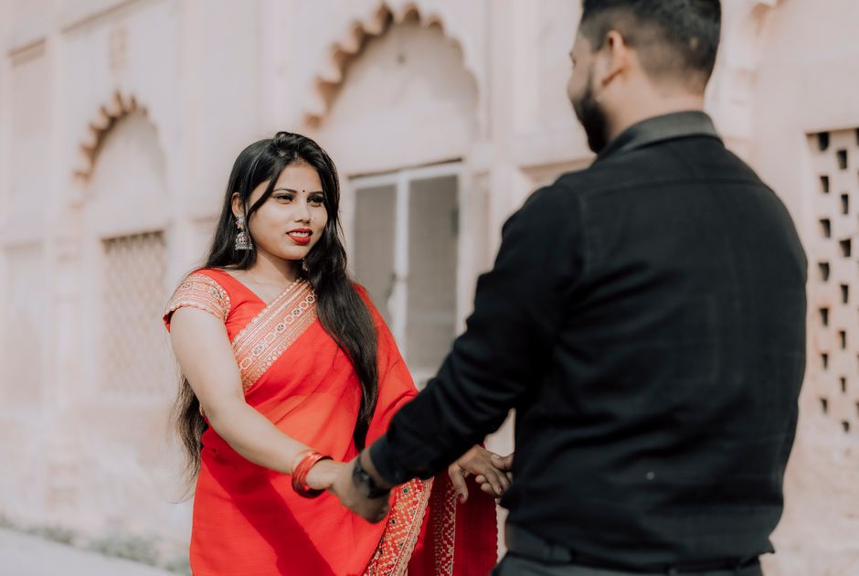 Beautiful Indian couple posing for pre-wedding photoshoot at scenic location