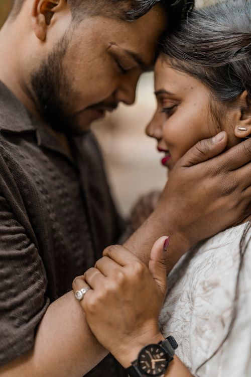 Free Close-up of a loving Indian couple embracing, showcasing affection and connection. Stock Photo