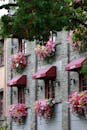 Charming Brick Building with Vibrant Floral Displays