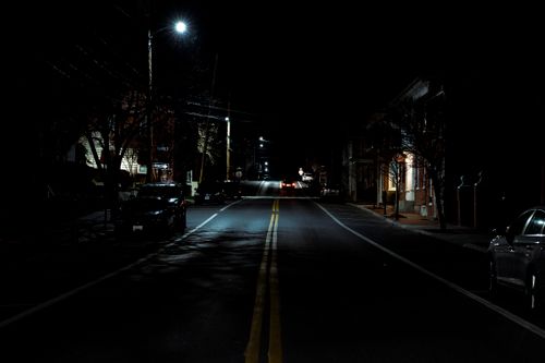 Free stock photo of calm urban scene, dark city street, dark road Stock Photo