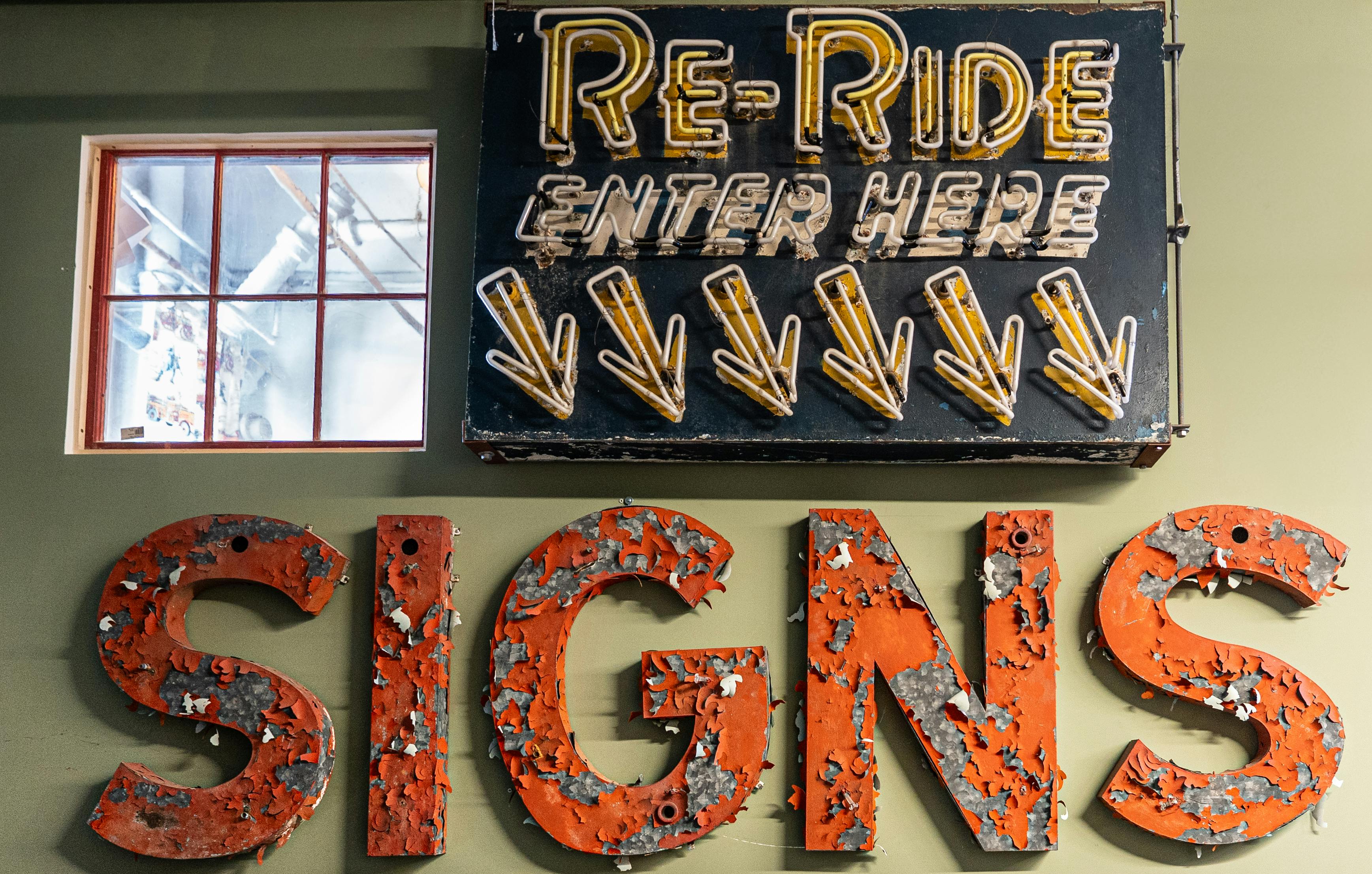 Faded vintage signs with neon lights in Somerville, Massachusetts. A retro display capturing urban nostalgia.