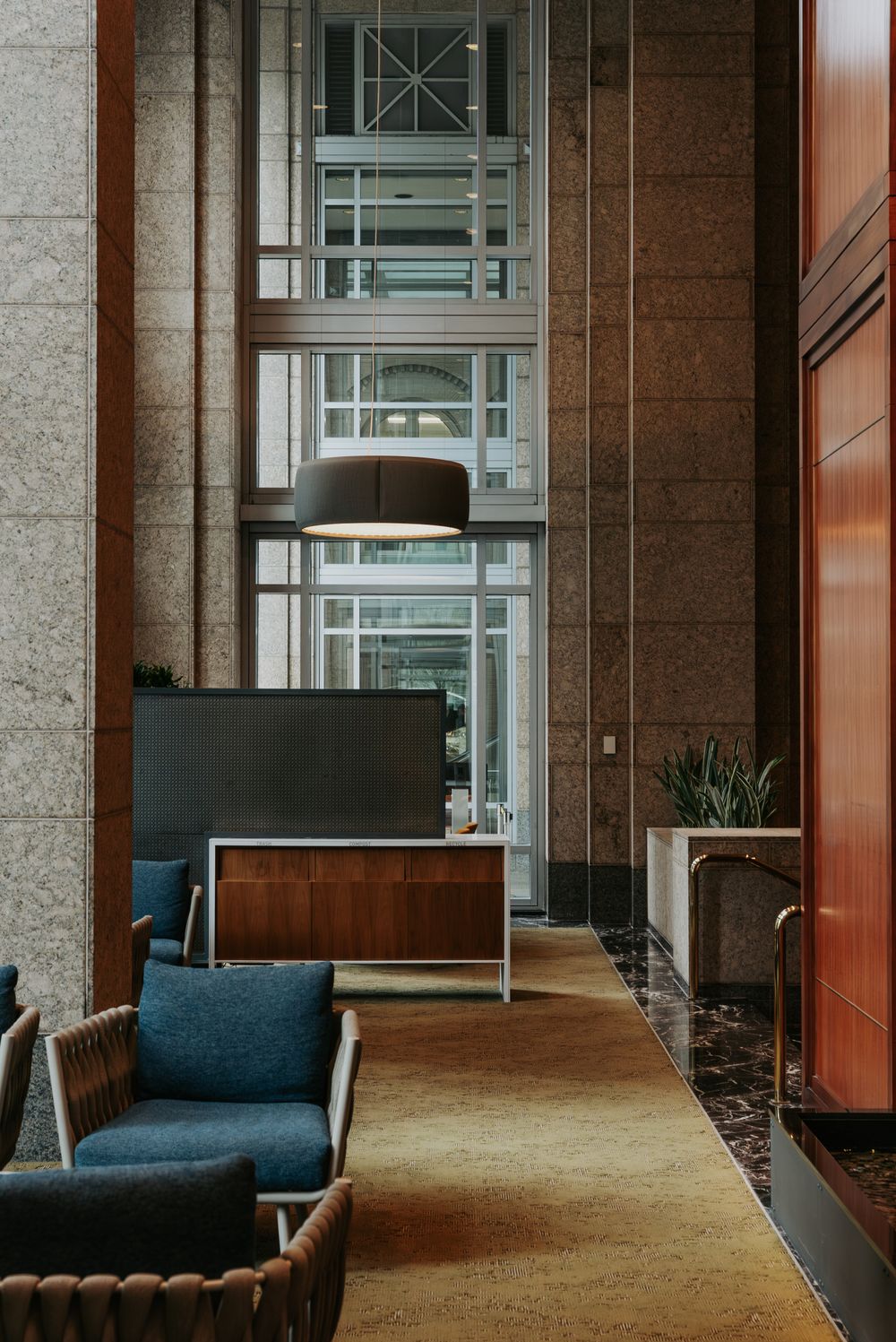 Warm, modern office atrium with seating in a Seattle commercial building