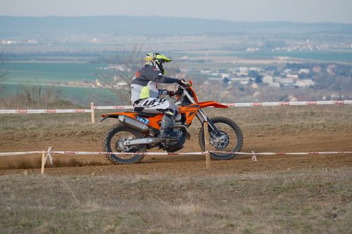 Free Motocross rider tackles dirt track in Jihomoravský Kraj, showcasing speed and skill. Stock Photo