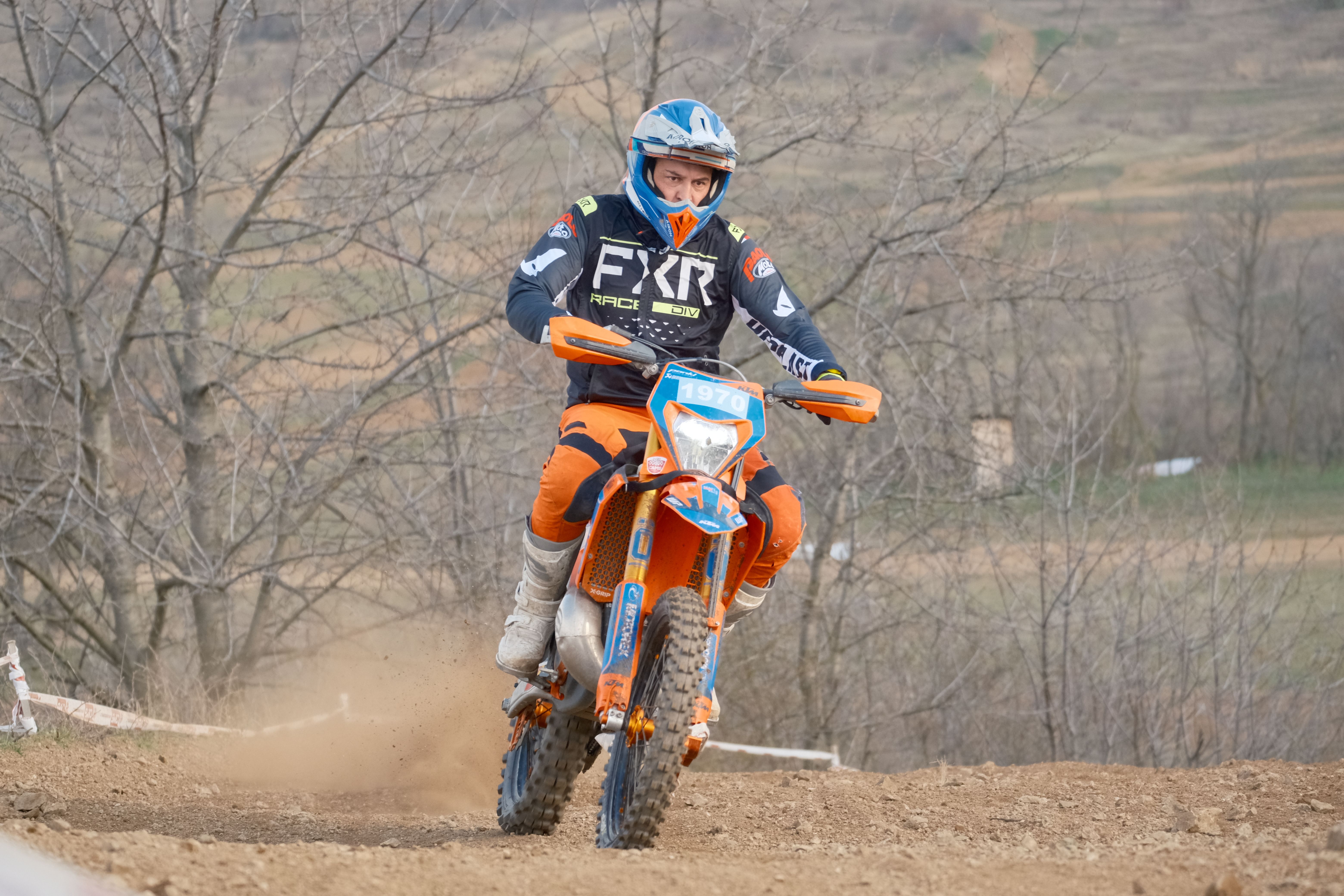 Dynamic motocross action in Jihomoravský kraj, Česko featuring a rider on a dirt bike.