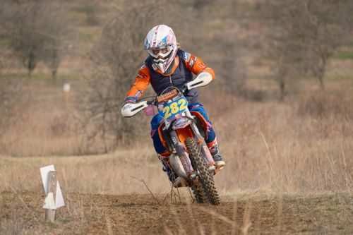 Free Exciting off-road motorcycle race in Jihomoravský kraj, Czech Republic, showcasing a rider in full gear speeding through the track. Stock Photo