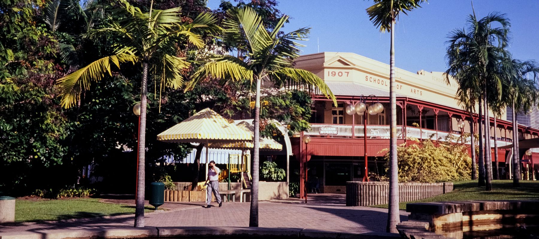 The 1907 School of Arts building with palm trees in Cairns, Queensland, Australia.