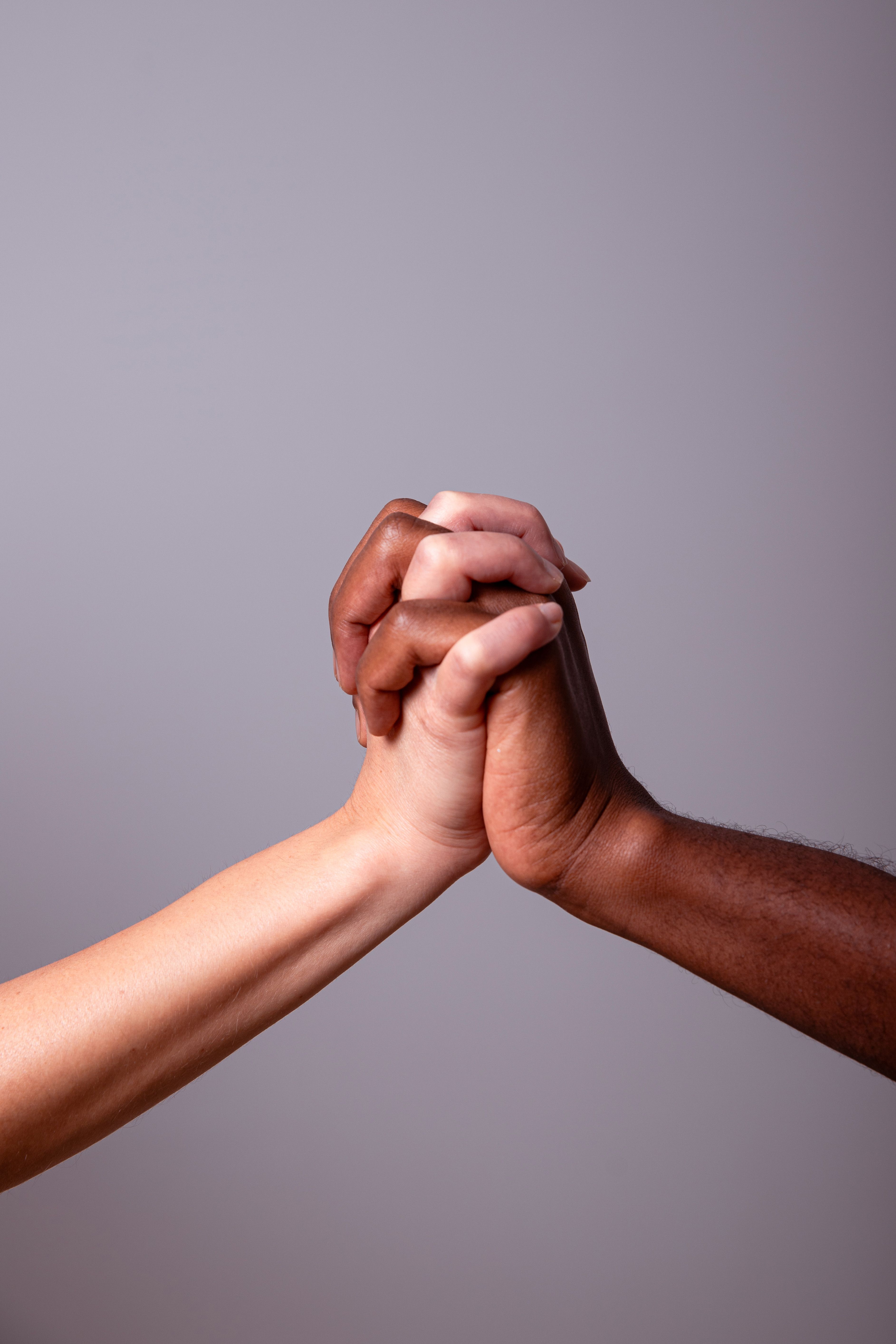Close Up Photo of Clasped Hands · Free Stock Photo