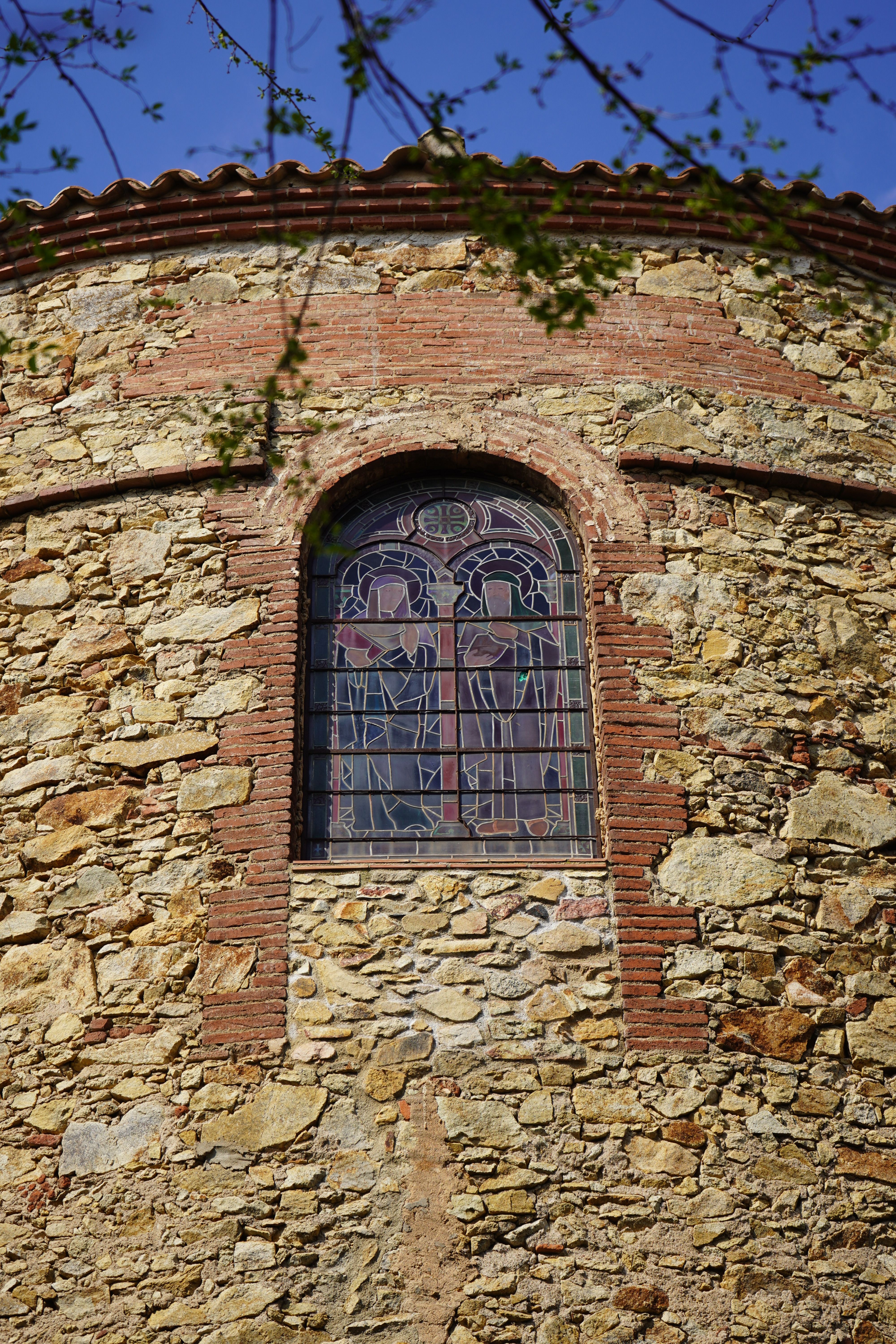Medieval Stained Glass Window in Stone Wall · Free Stock Photo