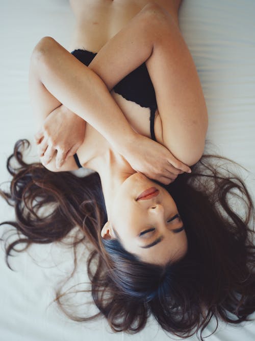 Free Woman Leaning on Bed Stock Photo