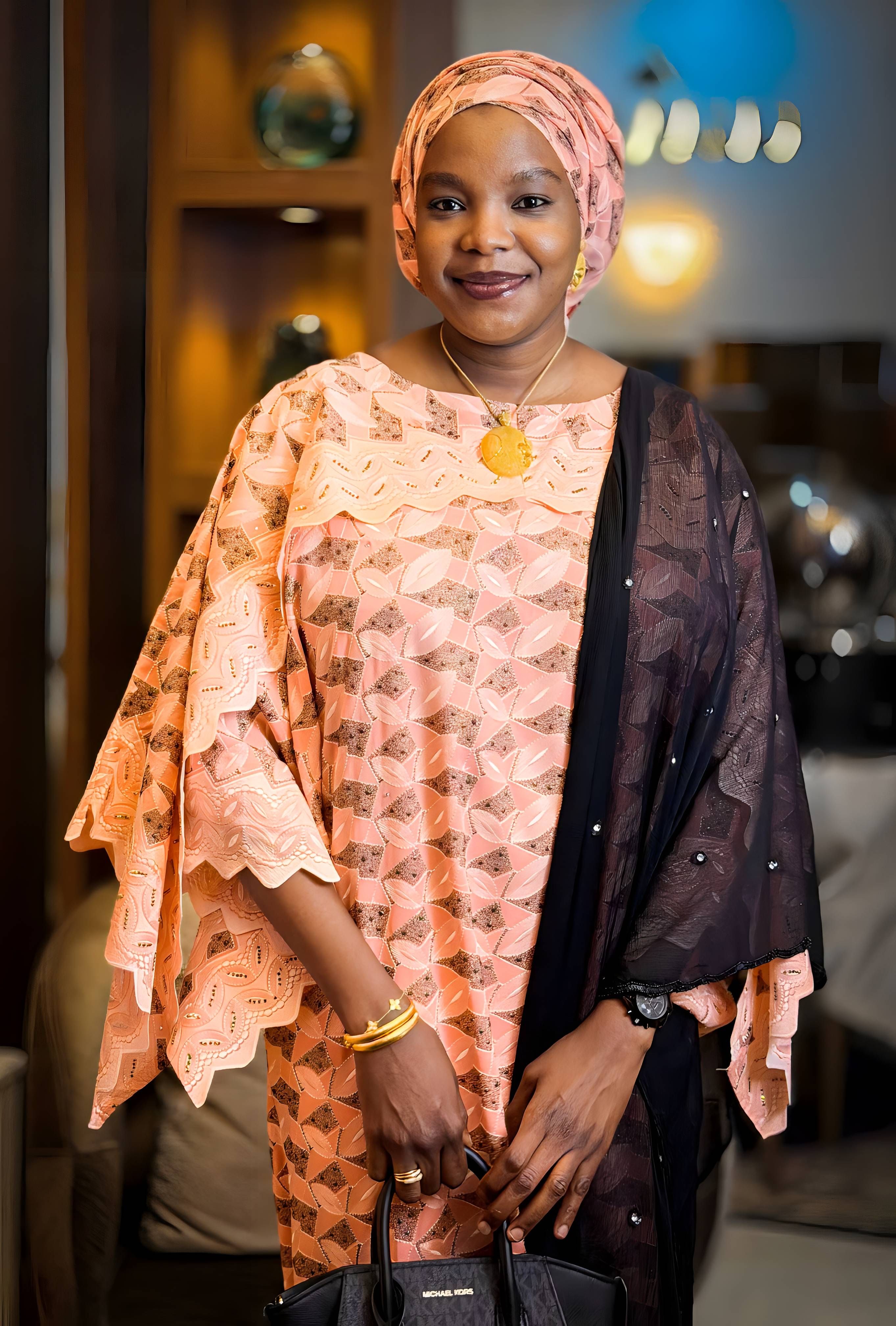 Elegant Woman in Traditional African Attire Indoors · Free Stock Photo
