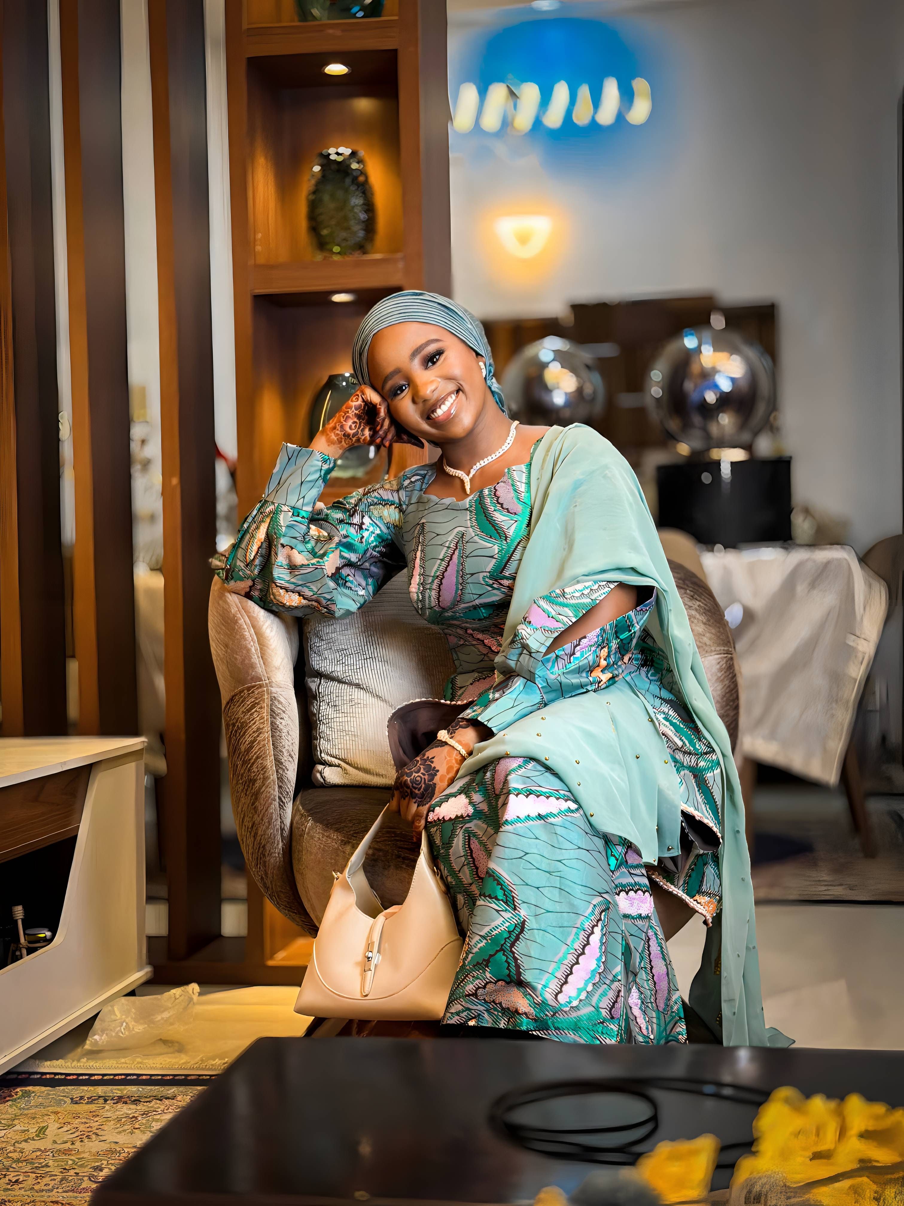 Elegant Woman in Traditional Ankara Dress Indoors · Free Stock Photo