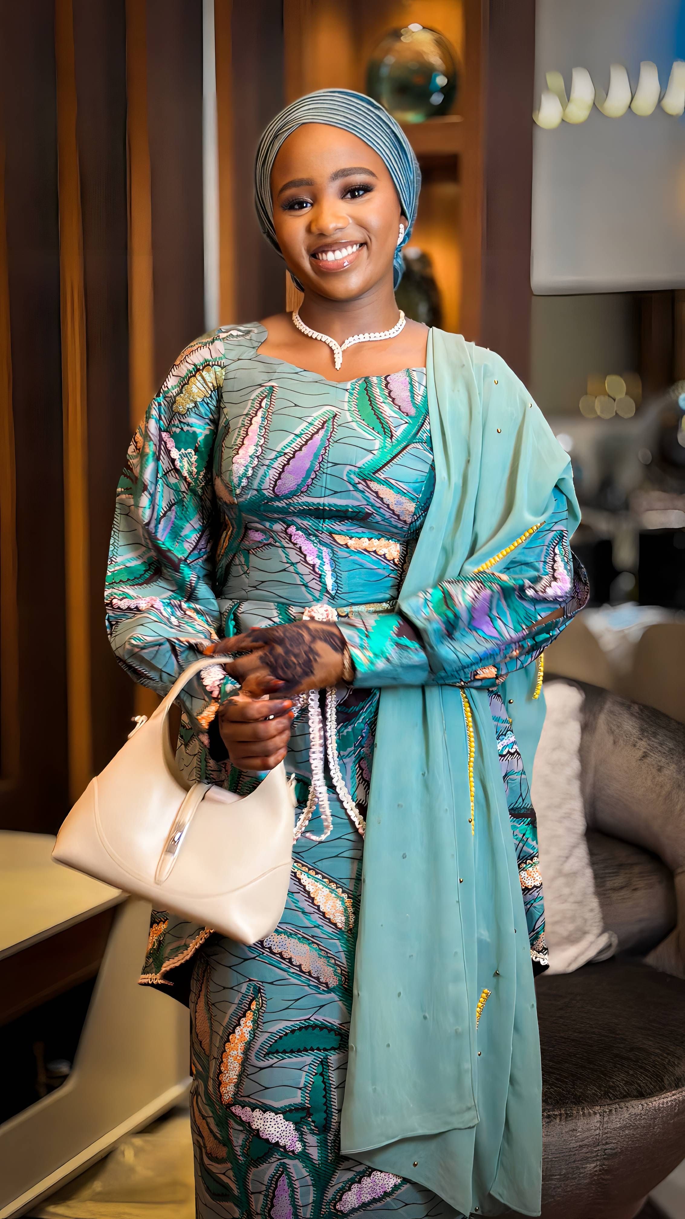 Elegant Woman in Traditional African Attire Indoors · Free Stock Photo