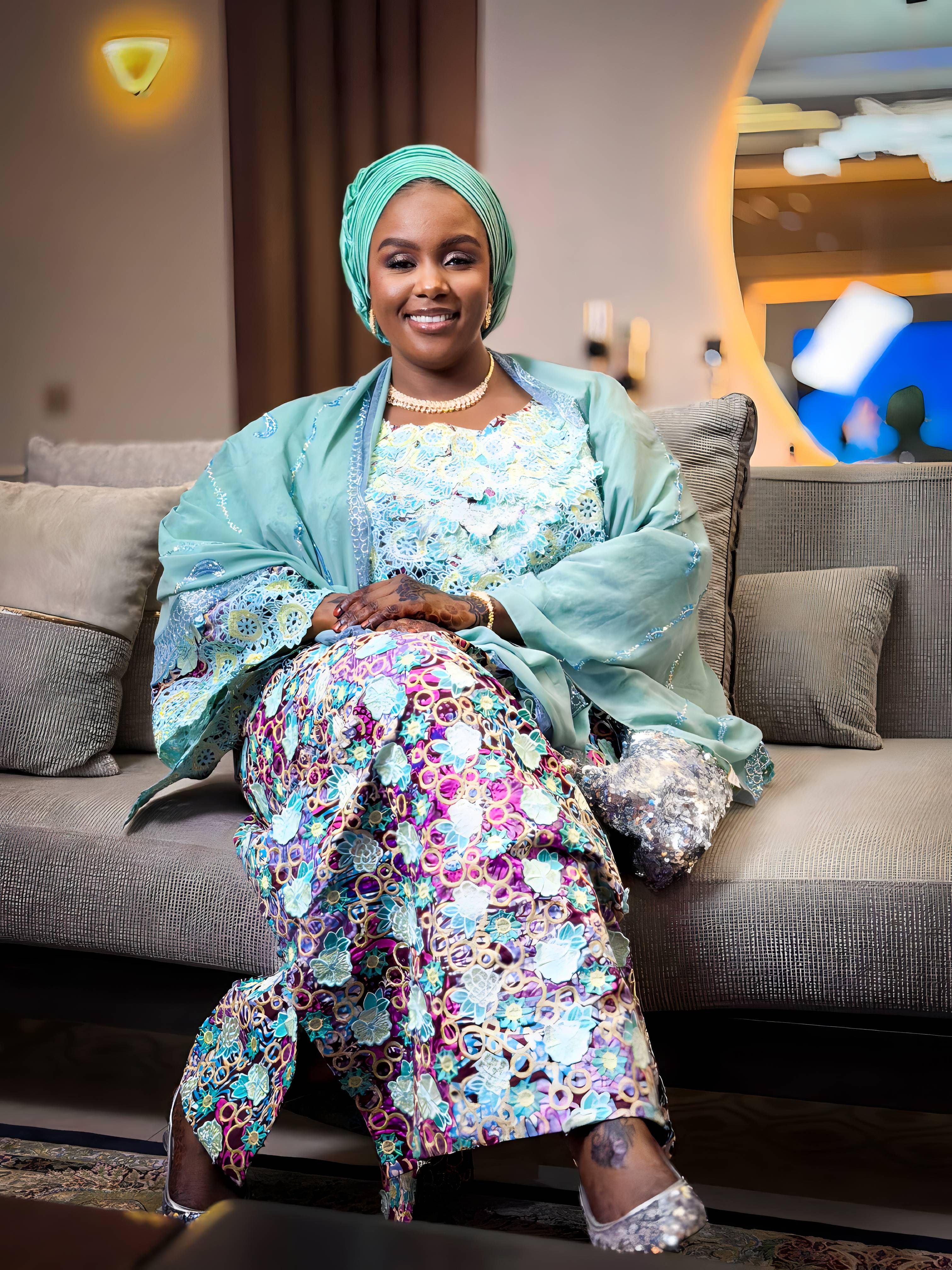 Elegant Woman in Traditional Attire Sitting Indoors · Free Stock Photo