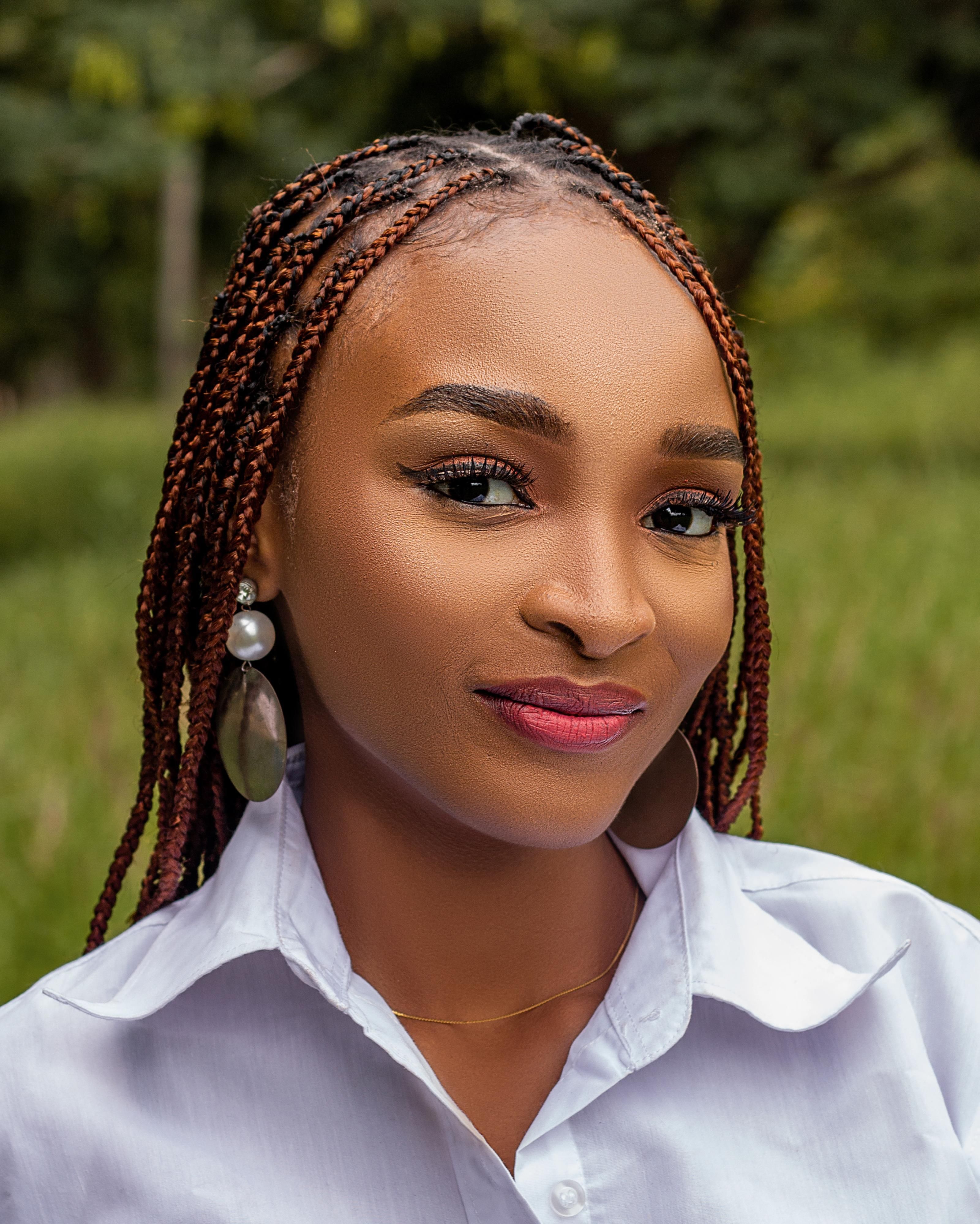 Portrait of Young Woman with Braids Outdoors · Free Stock Photo