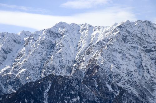 Free Stunning view of snow-covered rocky mountains under a clear blue sky. Stock Photo