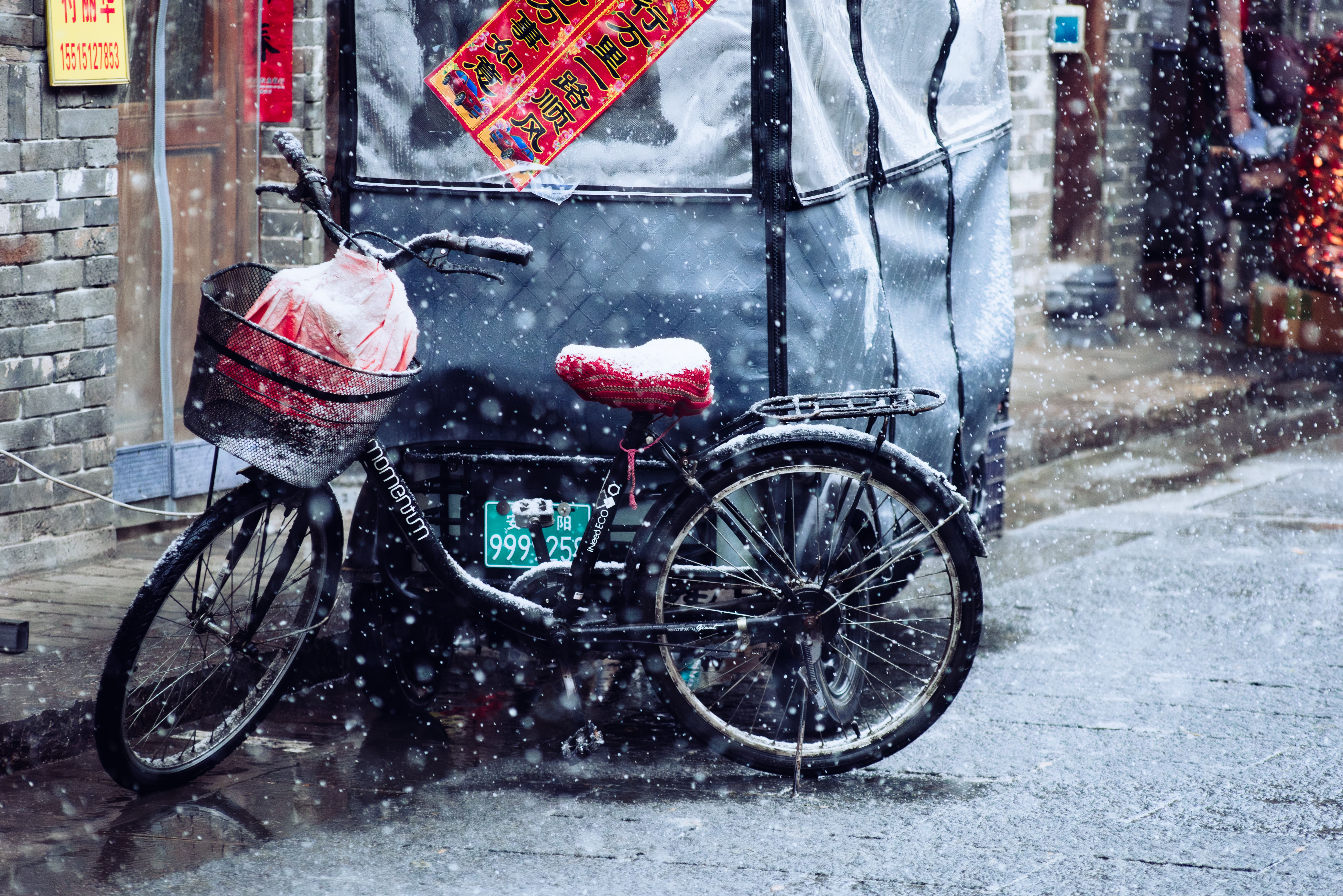 Bicycle by Snowy Street with Red Seat · Free Stock Photo