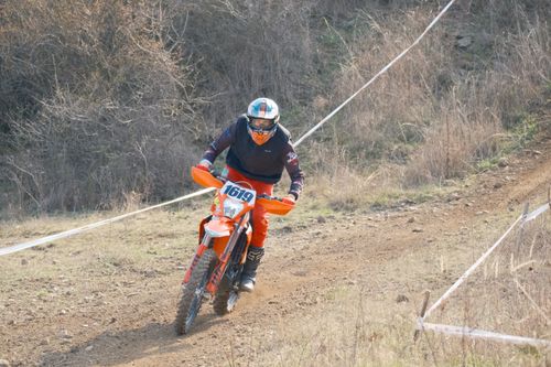 Free Motocross rider racing on a dirt track in Jihomoravský kraj, Czech Republic during daylight. Stock Photo