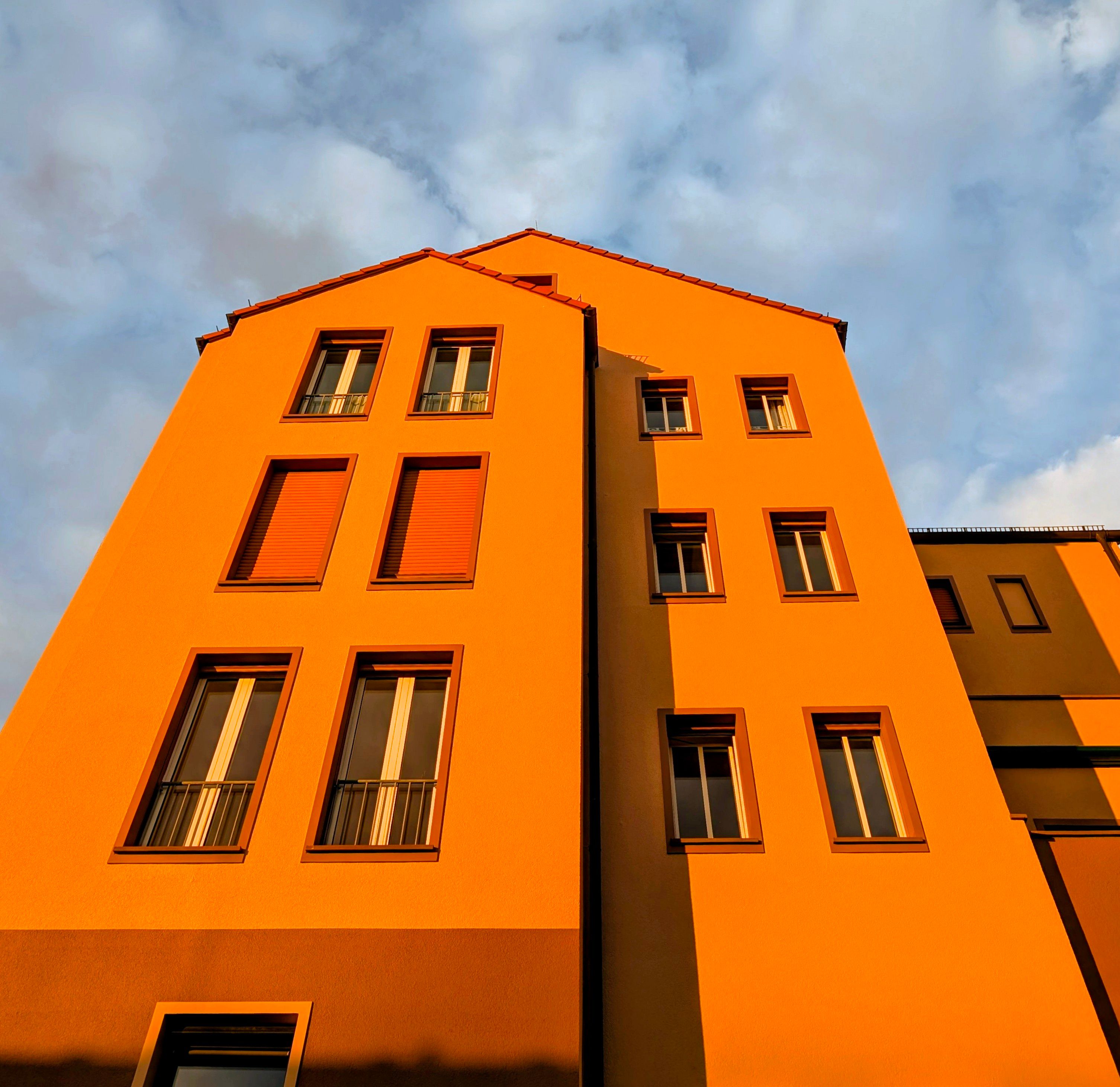 Modern Orange Building Facade at Sunset · Free Stock Photo