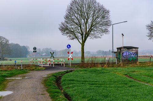 Free Quiet rural landscape with railroad crossing in Coesfeld, Germany. Stock Photo