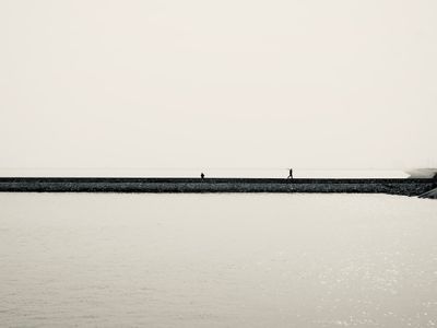 Minimalist black and white seascape with pier — Pexels User on Pexels
