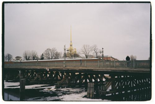 Free A beautiful winter scene with a historic bridge and famous cathedral in Saint Petersburg. Stock Photo
