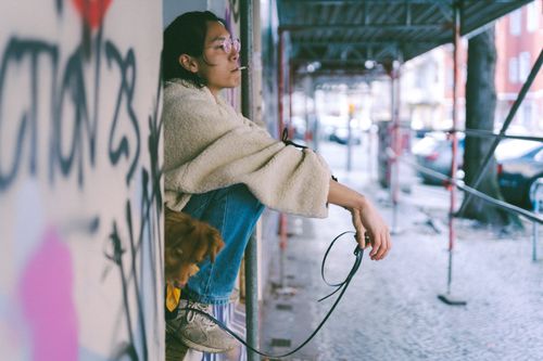 Free A reflective moment captured on the streets of Berlin, showcasing urban life and companionship. Stock Photo
