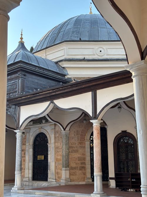 Free Elegant Ottoman architecture featuring intricate domes and arches. Stock Photo
