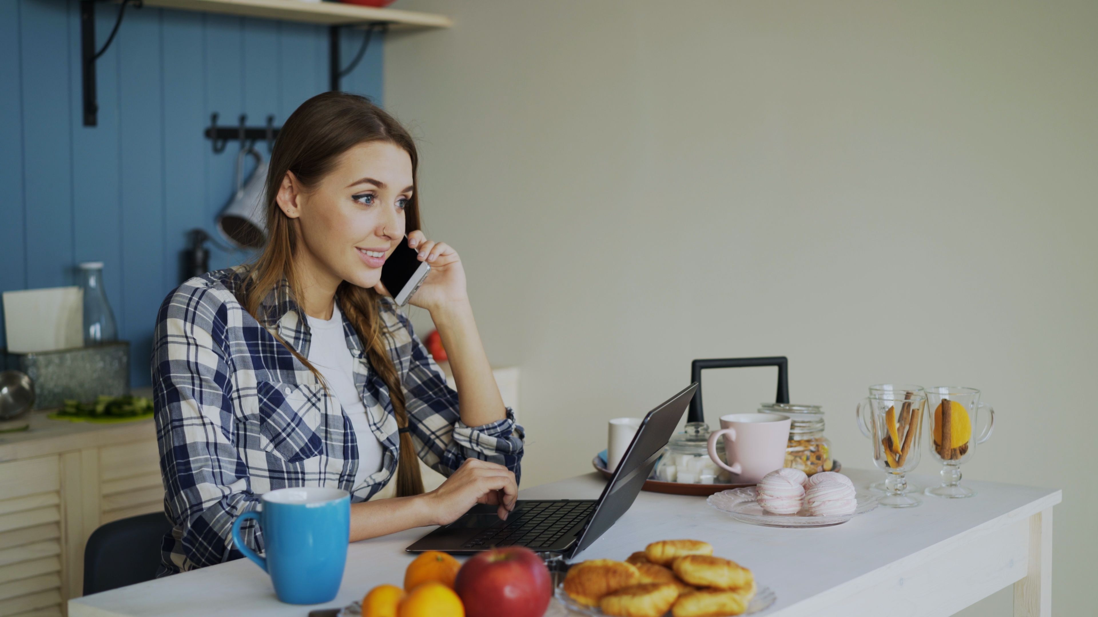 Woman Working Remotely from Home Kitchen · Free Stock Photo