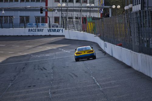Free A vibrant high-speed car en route on the Raceway Venray track, capturing the essence of motorsport. Stock Photo