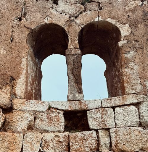 Free Rustic ancient stone window captured in Mersin, showcasing historic architecture. Stock Photo