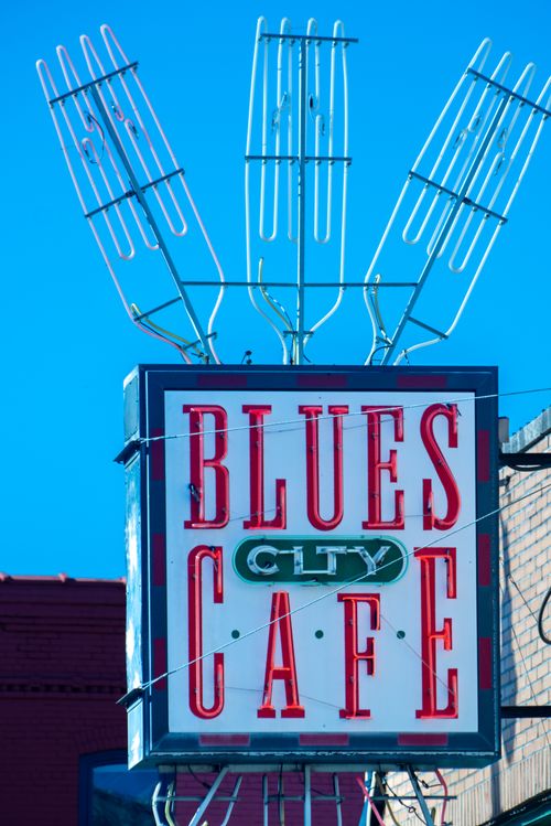 Free Bright neon sign of Blues City Cafe against a clear blue sky in Memphis, Tennessee. Stock Photo