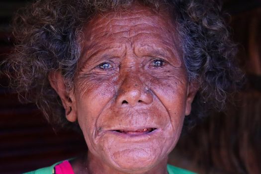 Close-up portrait capturing deep expression and emotion of an elderly individual.